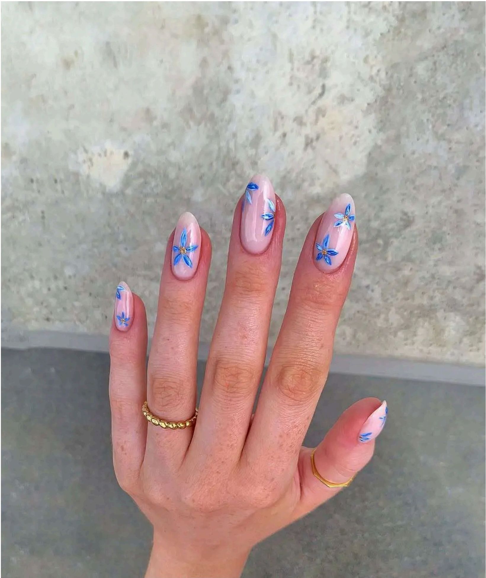 Pink nails with delicate cornflower blue florals – giving summer garden meets seaside escape.
