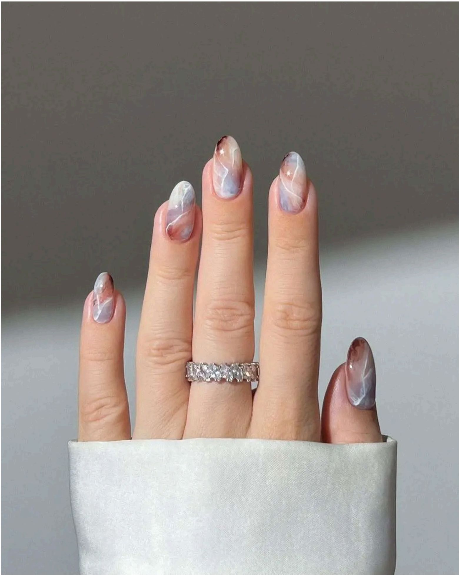 Swirling pinks, purples and white create the perfect beachy marble effect.