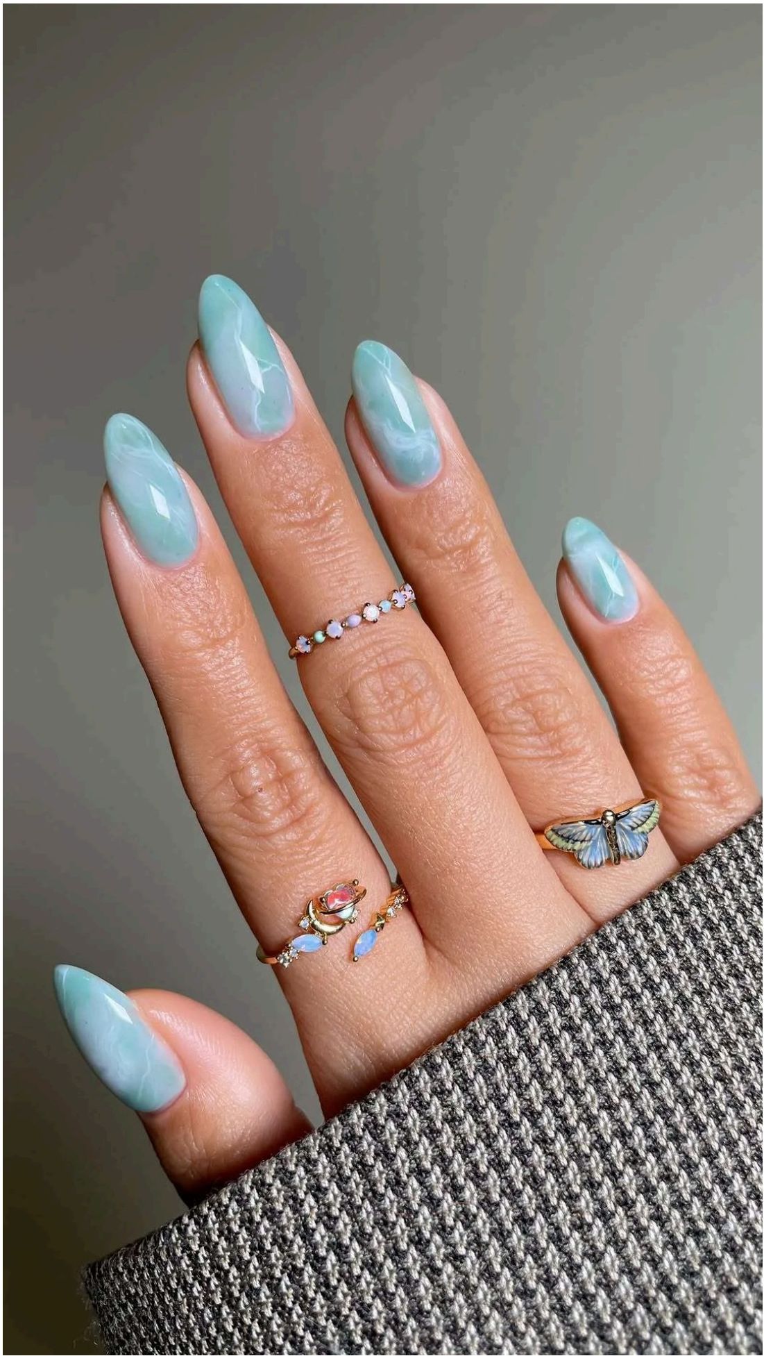 Dreamy light blue nails with white veining just like polished sea glass treasures.